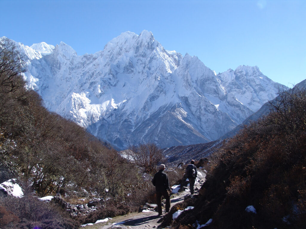 A tourist and a guide travelling to Manaslu region.